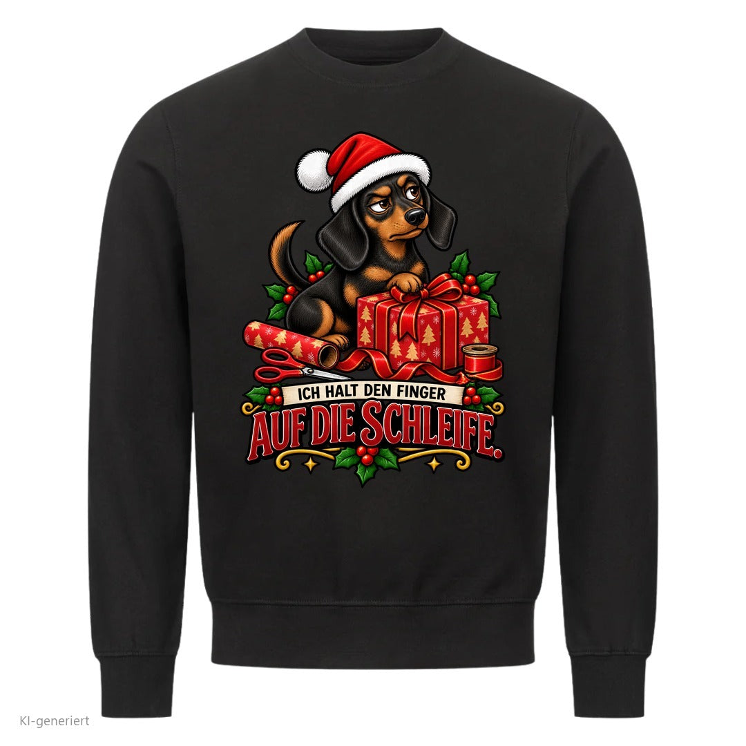 Partner Weihnachtspullover Dackel: Ich halt den Finger auf die Schleife - Sweatshirt in Schwarz